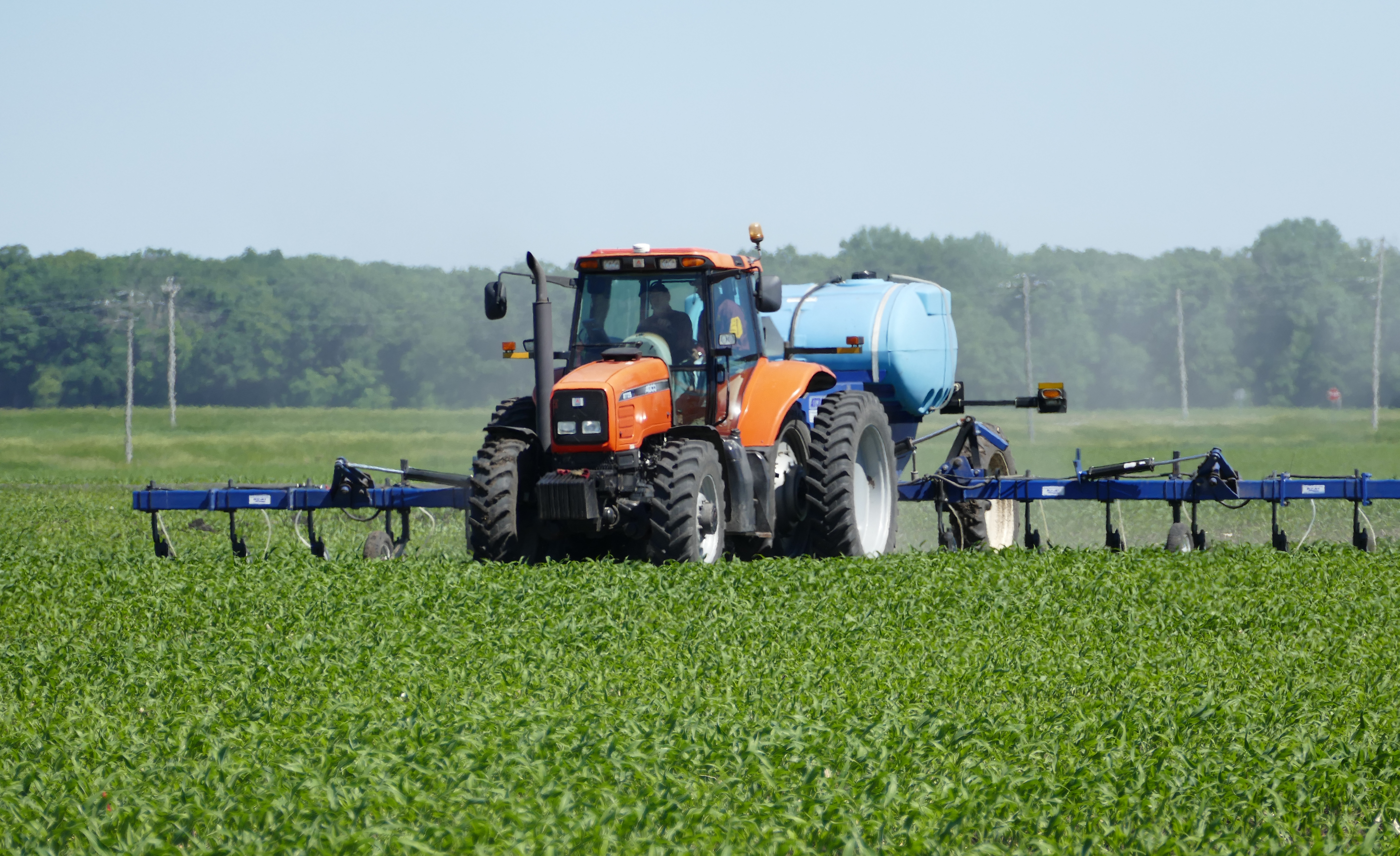A tractor spraying manure