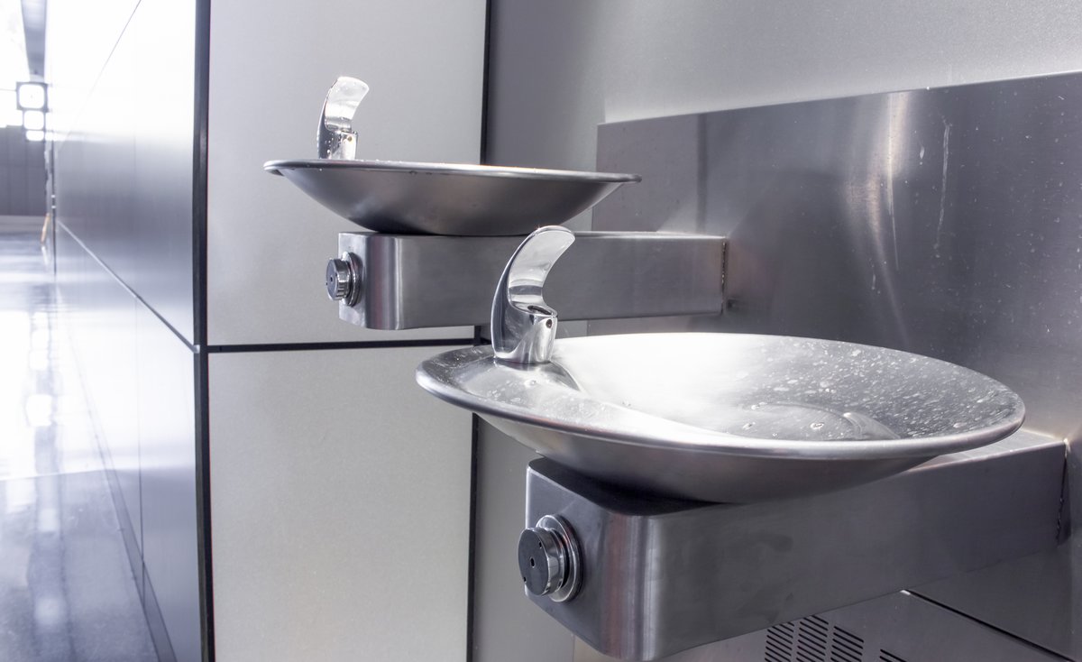 Two wall mounted drinking fountains