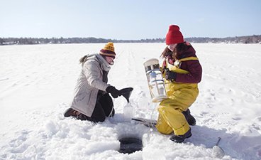 WRS students in Duluth collect water samples from a hole in ice.